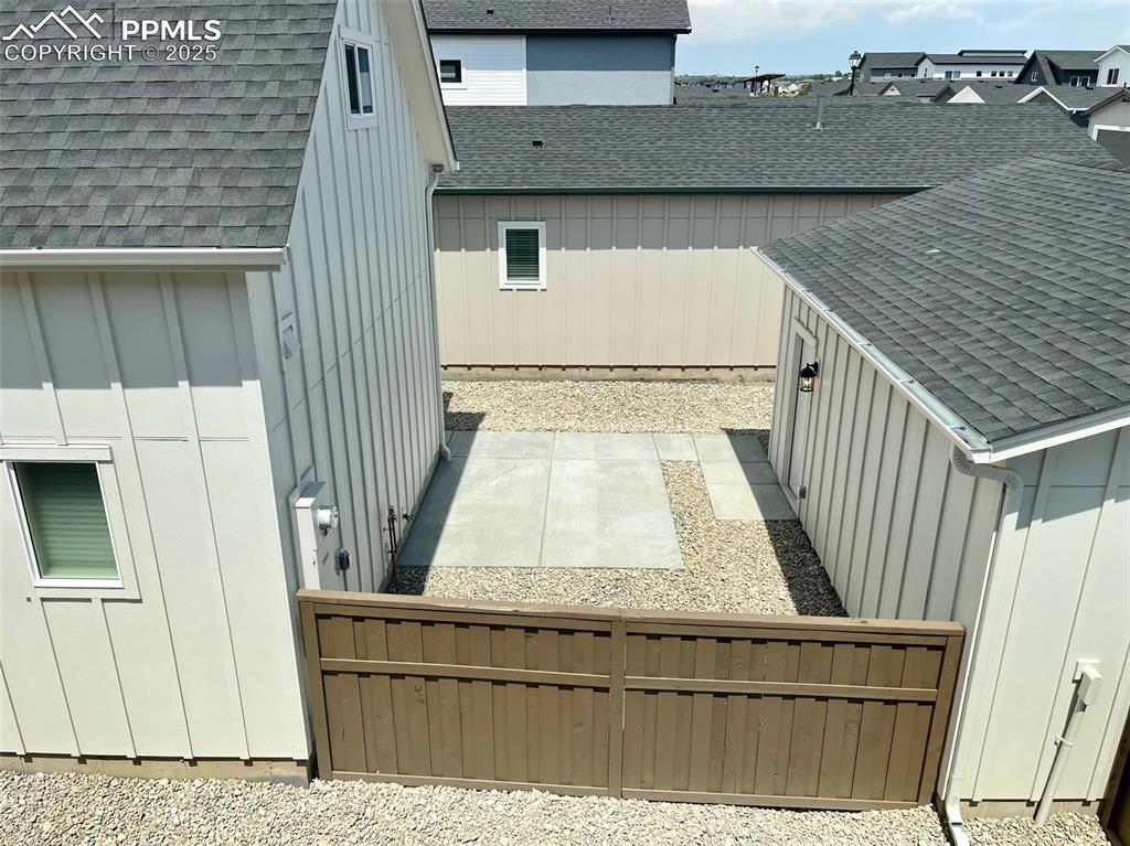 Image 14 of 22: Back of home and detached garage