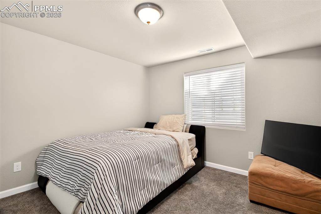 Image 17 of 35: Basement Bed