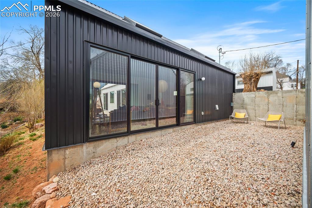 Image 15 of 50: Big sliding doors on each side of the home. Allows an abundance of natural