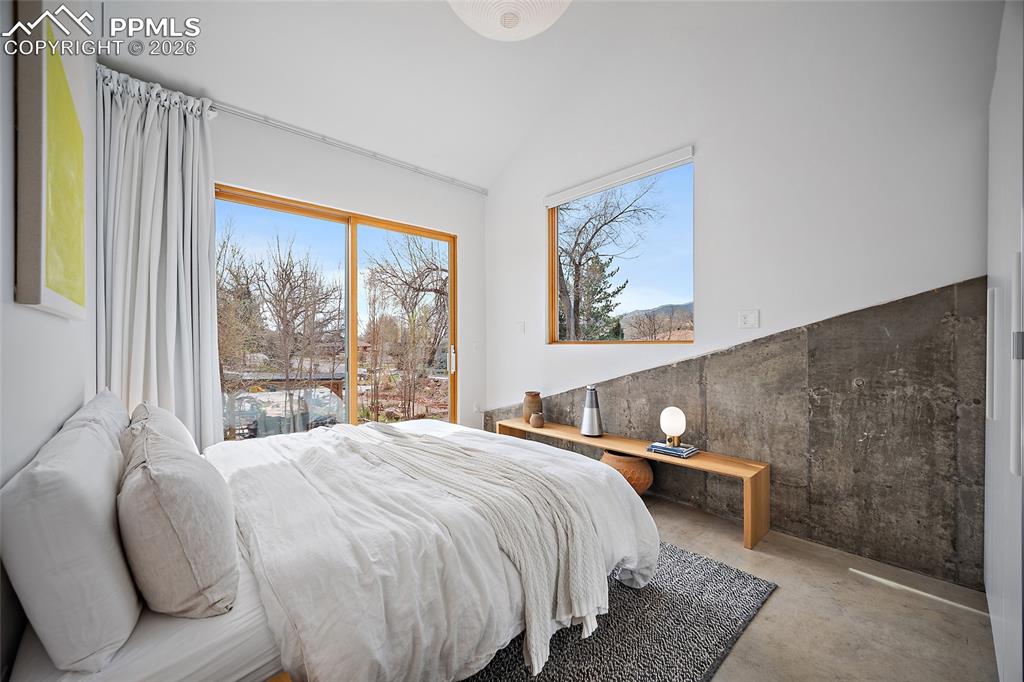 Image 23 of 50: Huge island with breakfast bar. Skylight adding natural lighting.