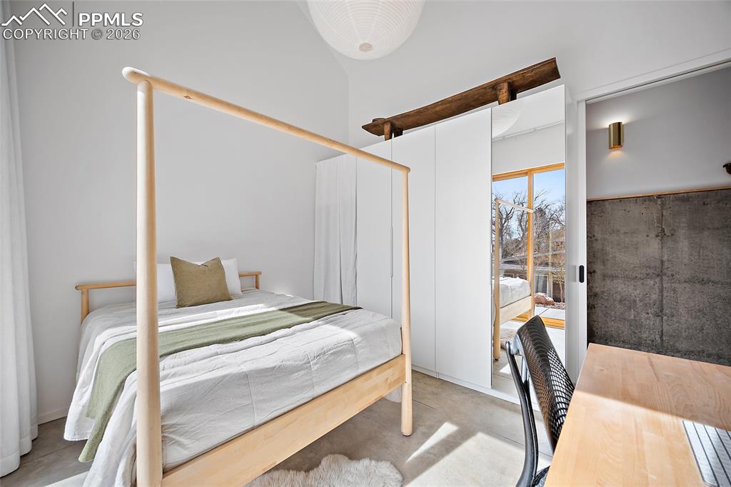 Image 30 of 50: Walk in tiered shower with privacy, tile stone and sleek granite sink offer
