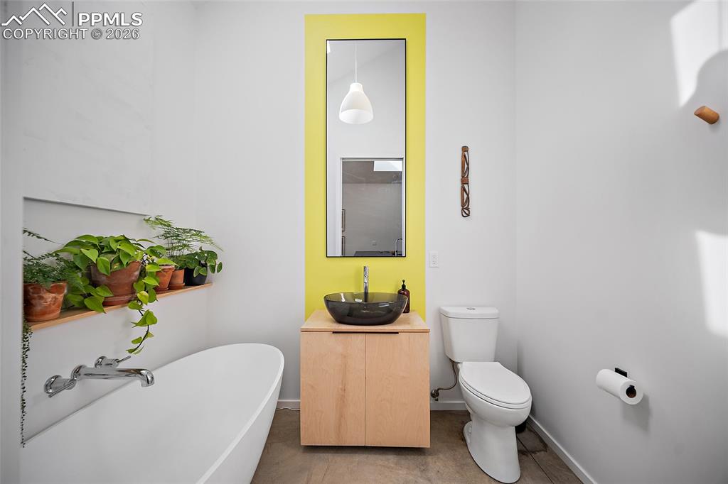 Image 31 of 50: Vessel Rectangular Modern White Bathroom Sink sitting on sleek granite.