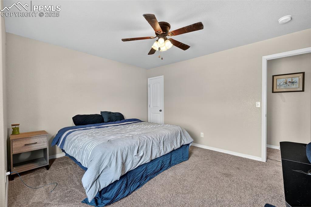 Image 26 of 33: Bedroom featuring carpet floors and a ceiling fan