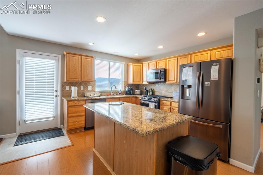 Image 11 of 45: Kitchen with walk out deck - main floor