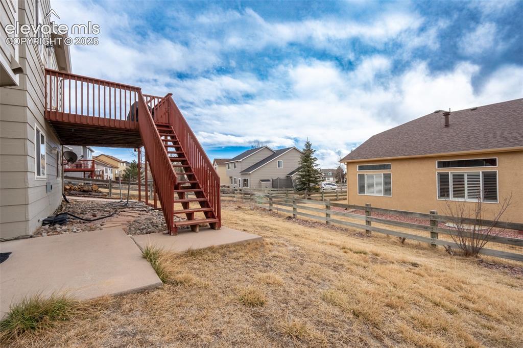 Image 12 of 46: Back yard/deck
