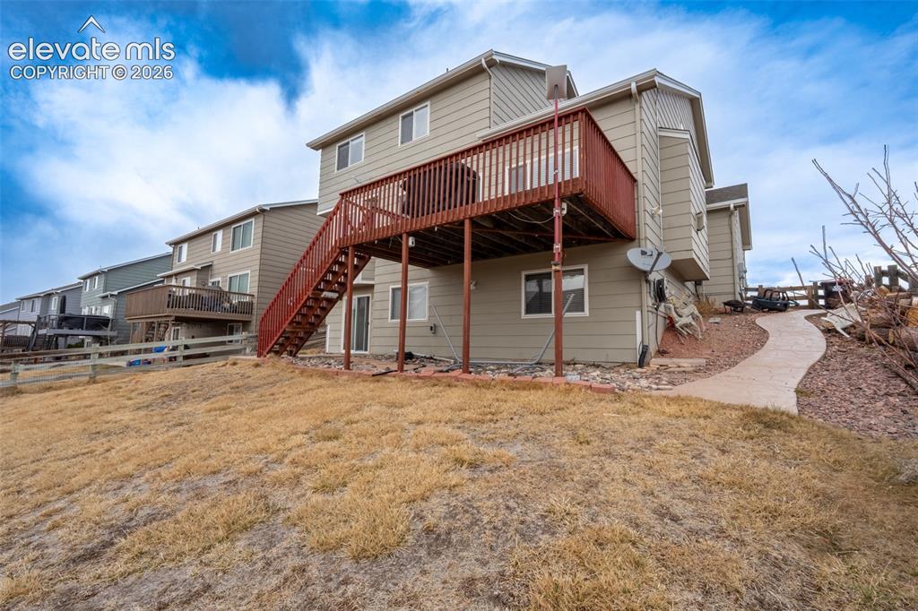 Image 13 of 46: Back yard/deck