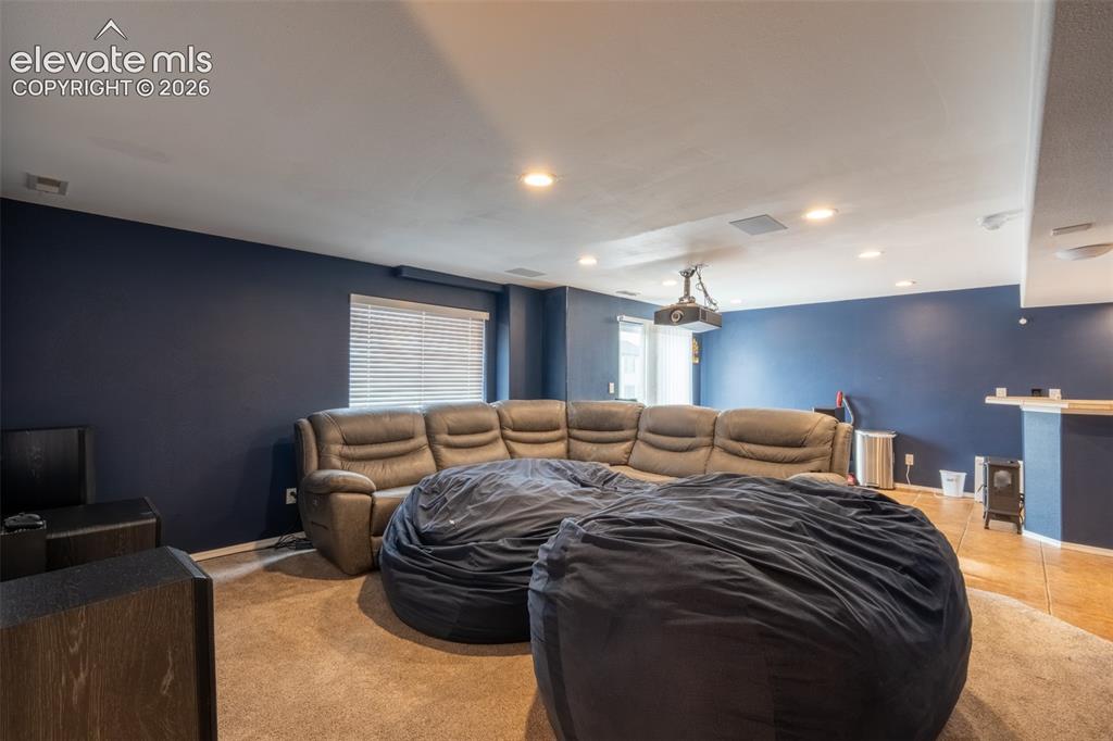 Image 32 of 46: Living room/home theater - basement