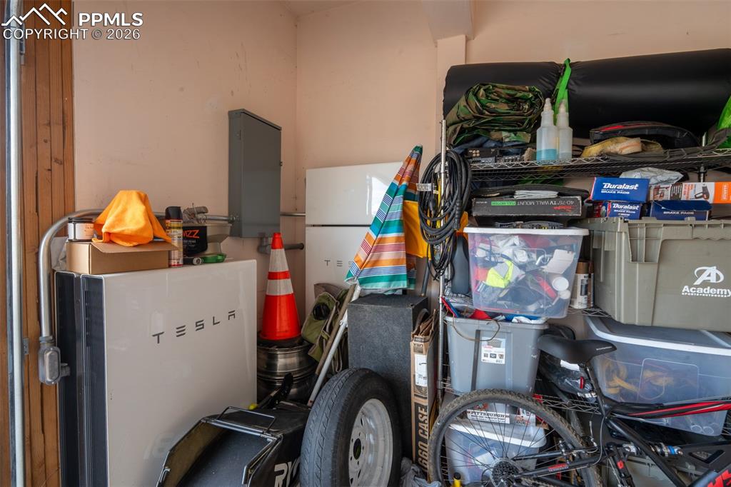 Image 39 of 45: 2 car garage with Tesla Powerwalls
