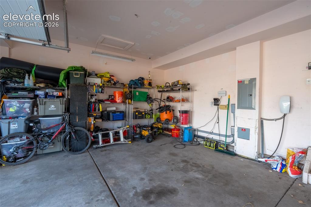 Image 40 of 46: 2 car garage with level 2 EV charger