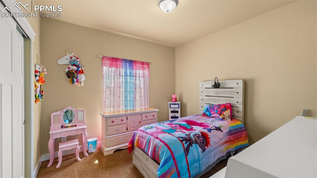 Image 15 of 50: Bedroom featuring carpet and a closet