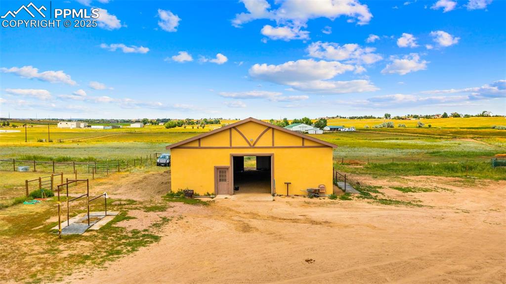 Image 34 of 50: View of outbuilding featuring a view of rural / pastoral area