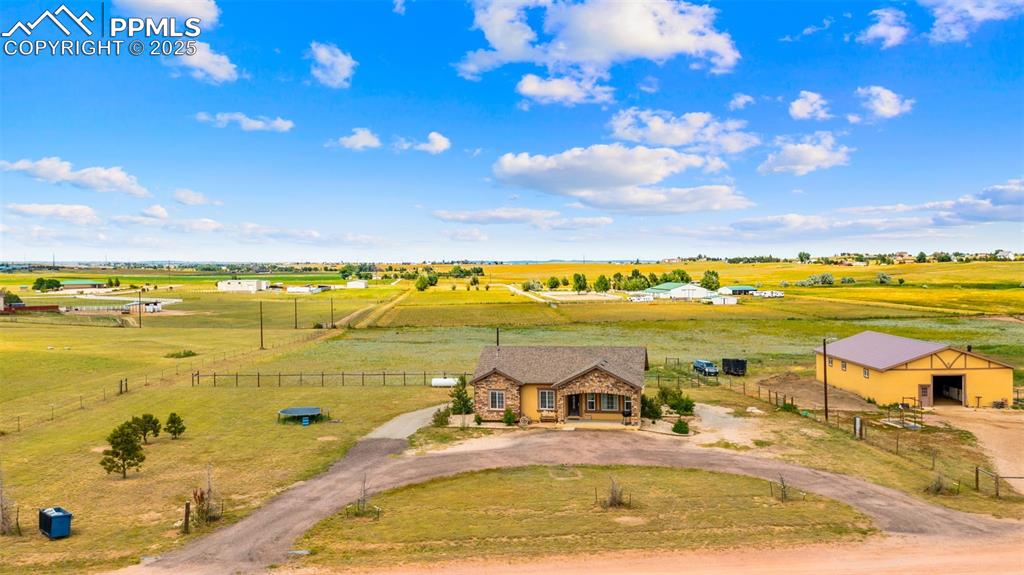 Image 35 of 50: Aerial view of sparsely populated area with a pastoral area
