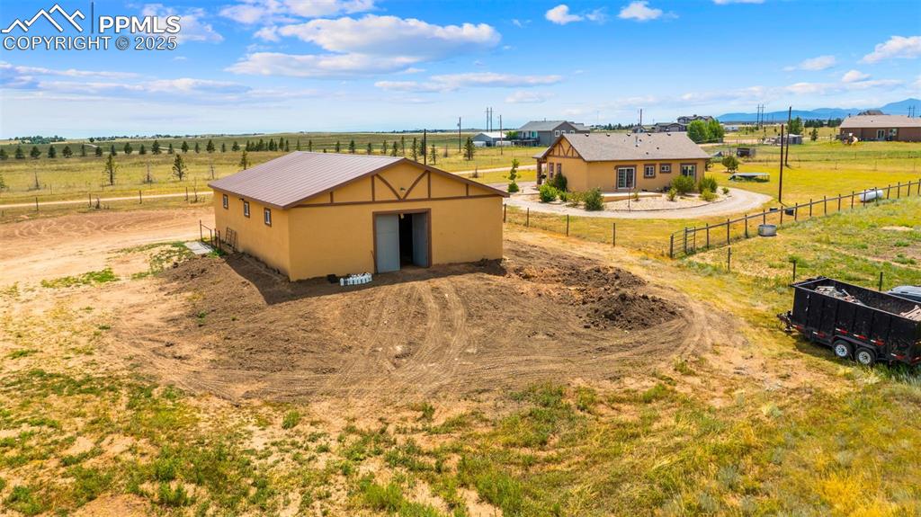 Image 37 of 50: View of outbuilding featuring a view of rural / pastoral area