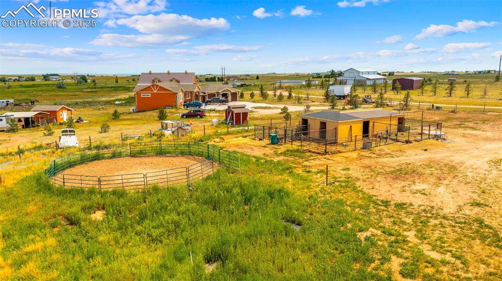 Image 38 of 50: View of yard with an exterior structure, a rural view, and an outbuilding