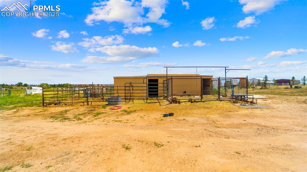 Image 45 of 50: View of outdoor structure featuring an exterior structure and a rural view