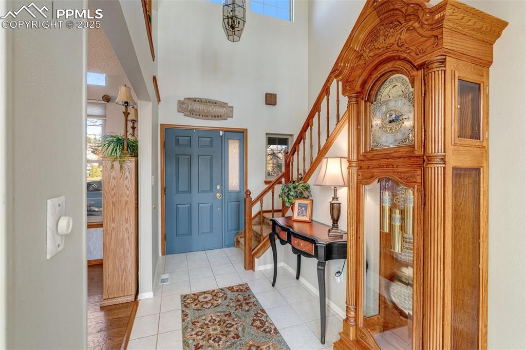 Image 10 of 41: Entrance foyer featuring healthy amount of natural light, stairway, light t