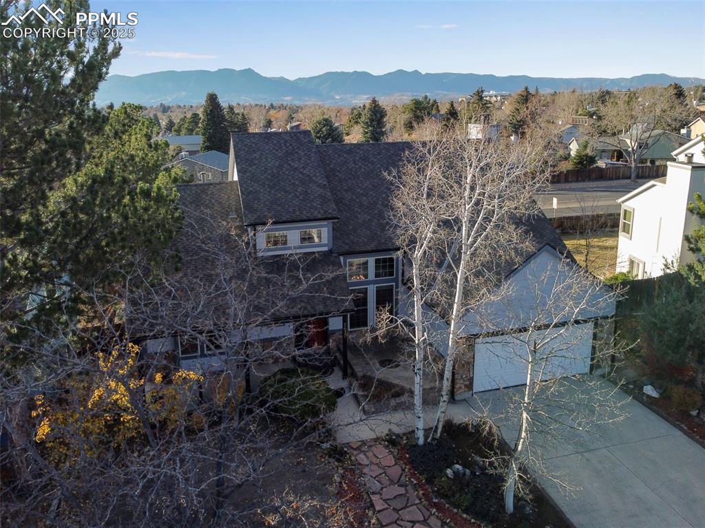 Image 2 of 41: Aerial view of residential area with a mountain backdrop