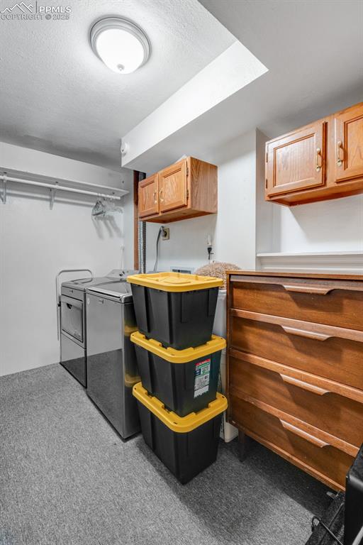 Image 26 of 41: Spacious laundry room with storage and laundry chute from primary closet. 