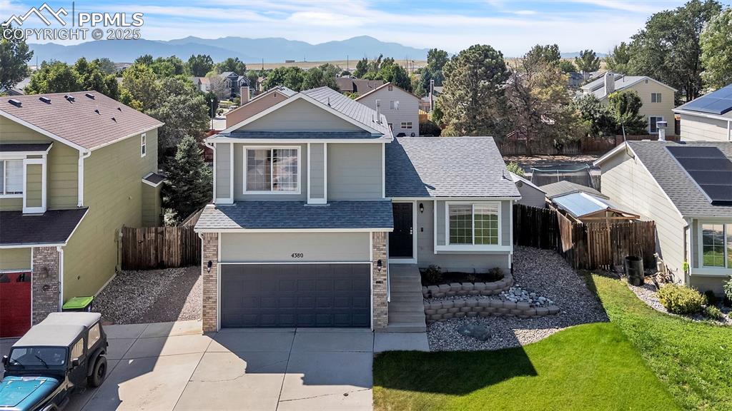 Image 31 of 43: View of front of property featuring a shingled roof, a residential view, a