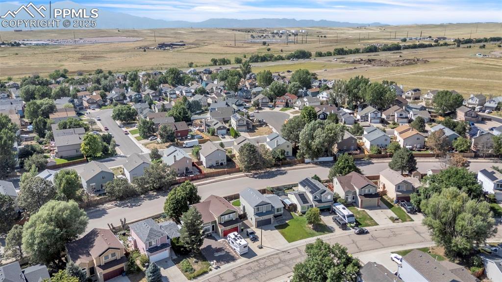 Image 42 of 43: Aerial view of property and surrounding area featuring nearby suburban area