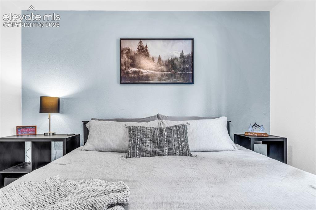 Image 14 of 37: Room featuring a two-tone wall design with a light blue accent wall and whi