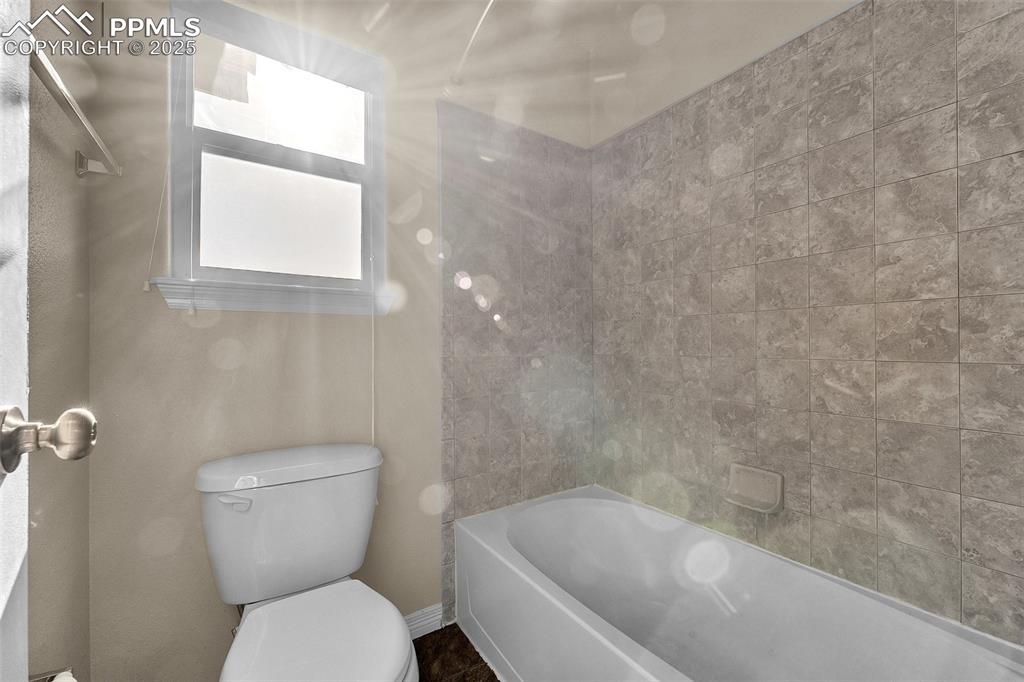 Image 23 of 28: Full bathroom featuring toilet