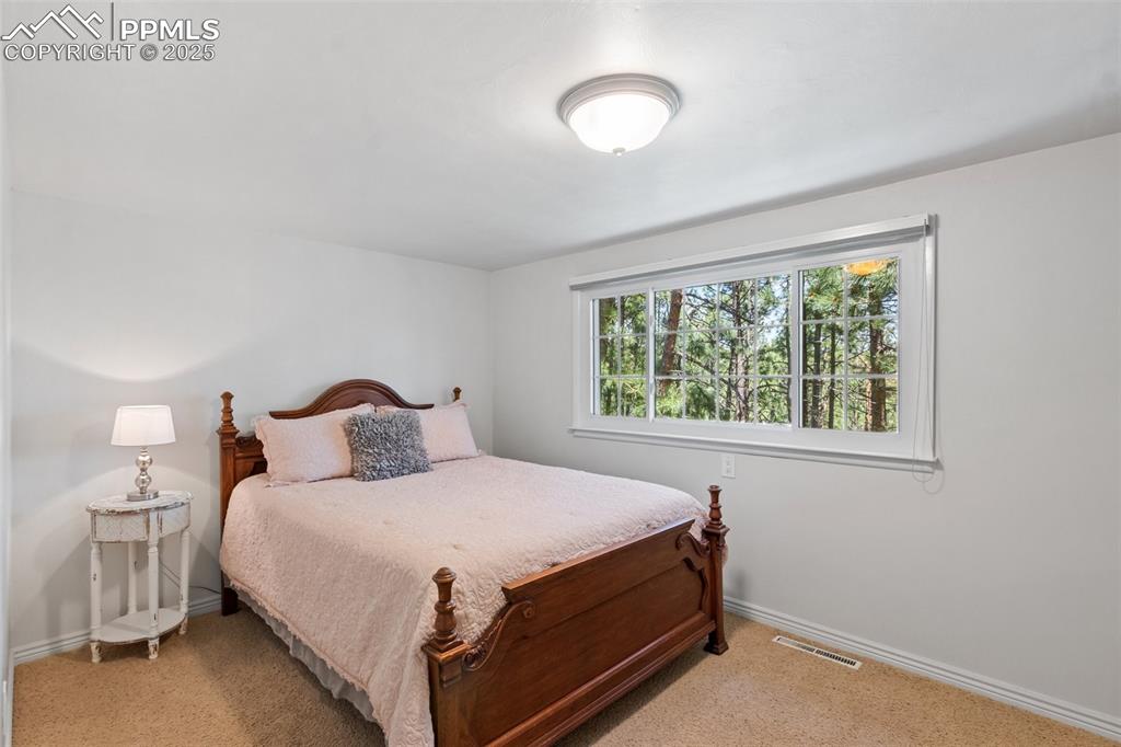 Image 30 of 50: Upstairs bedroom