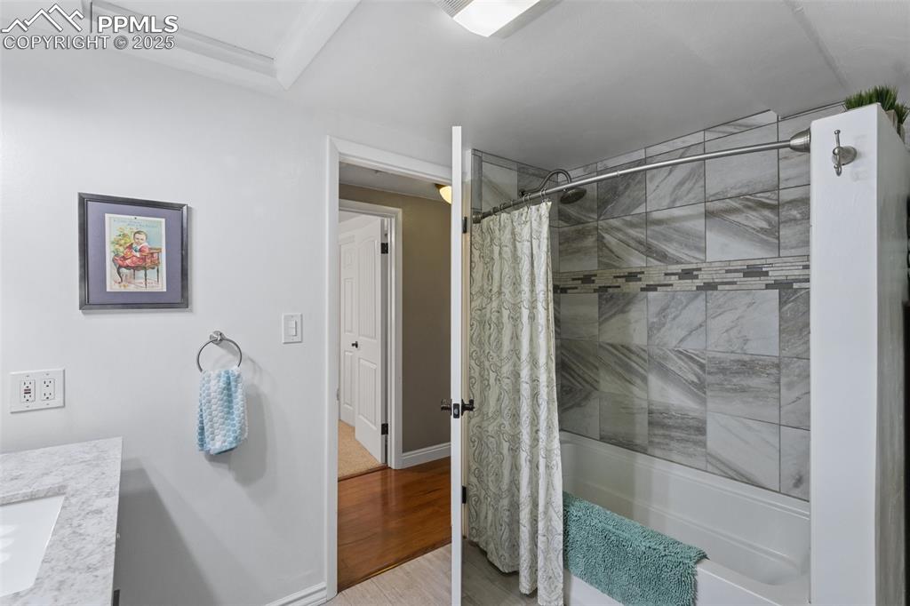 Image 32 of 50: Full bathroom with shower / bath combination and vanity