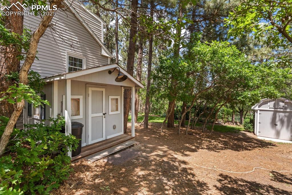 Image 48 of 50: View of shed with entry steps