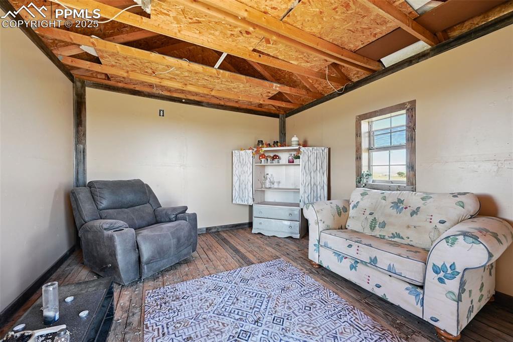 Image 18 of 48: Living area featuring hardwood / wood-style floors