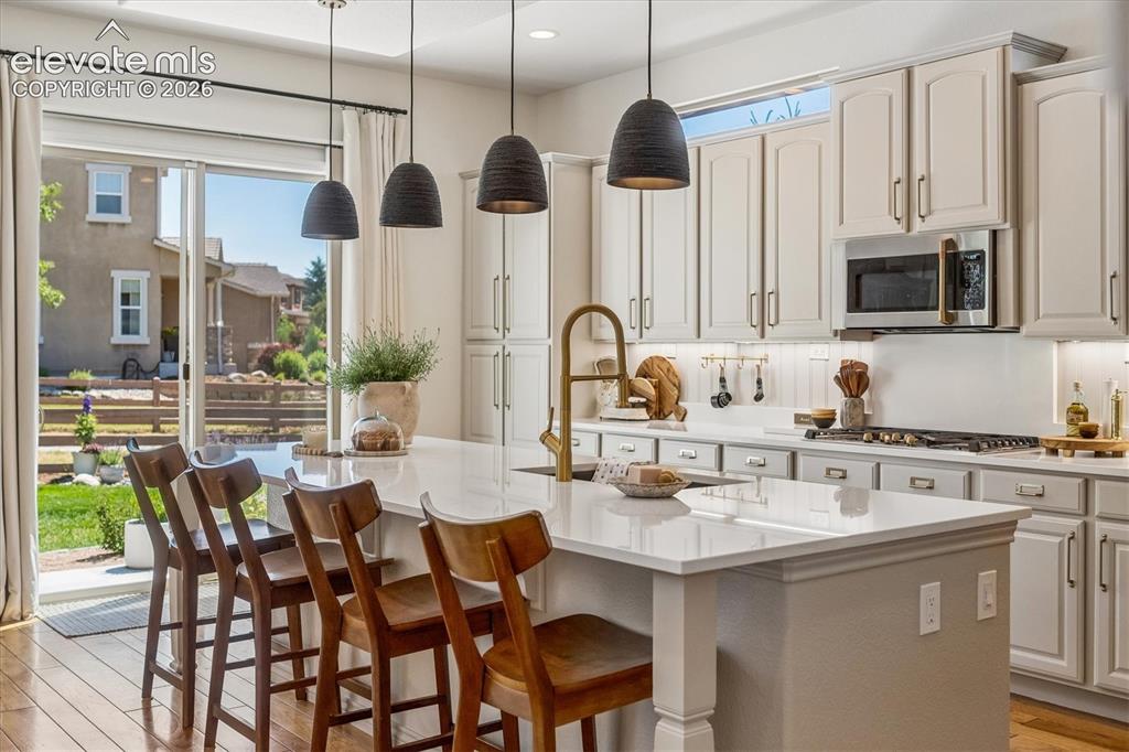 Image 12 of 50: Gourmet kitchen featuring a large central island