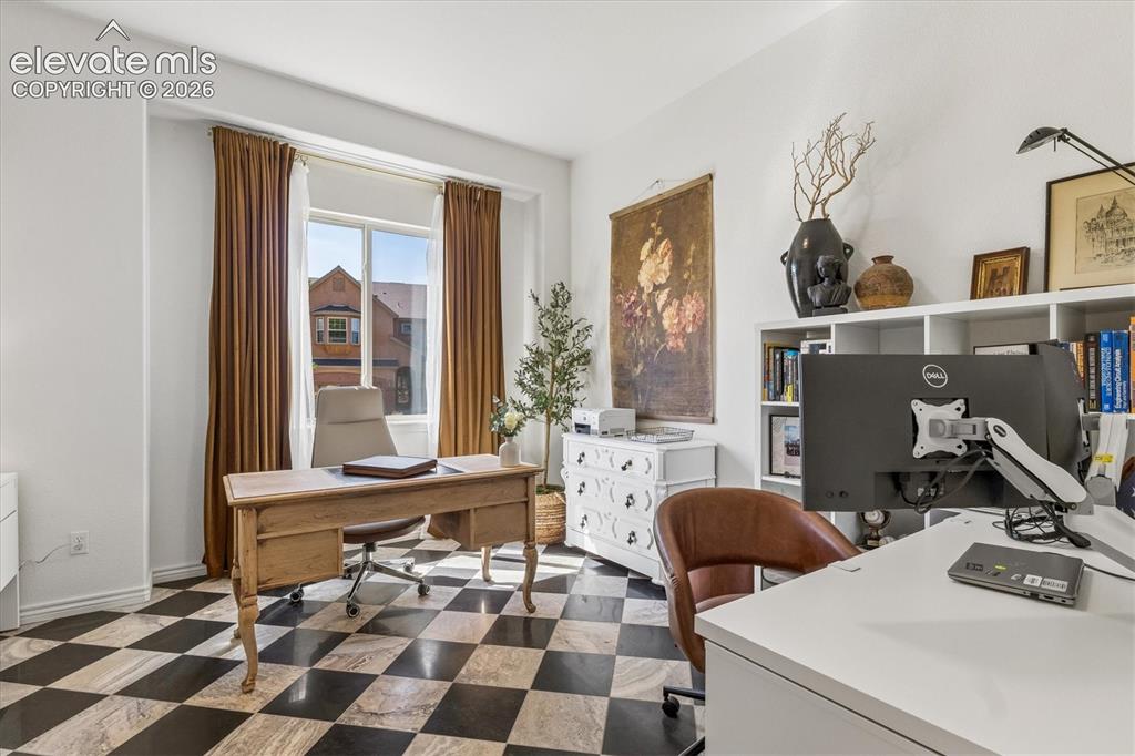 Image 23 of 50: Main level office showcasing checkerboard tile flooring