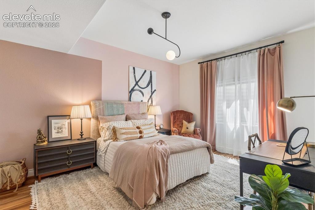 Image 24 of 50: Bedroom featuring a contemporary ceiling light fixture