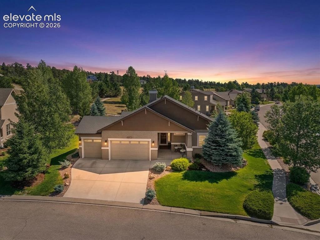 Image 50 of 50: Ranch-style exterior with a three-car garage, new concrete driveway, and a
