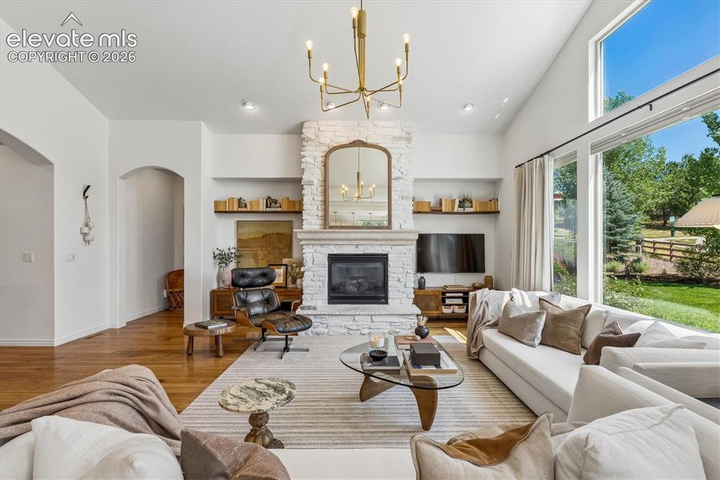 Image 6 of 50: Vaulted ceiling living area and expansive windows