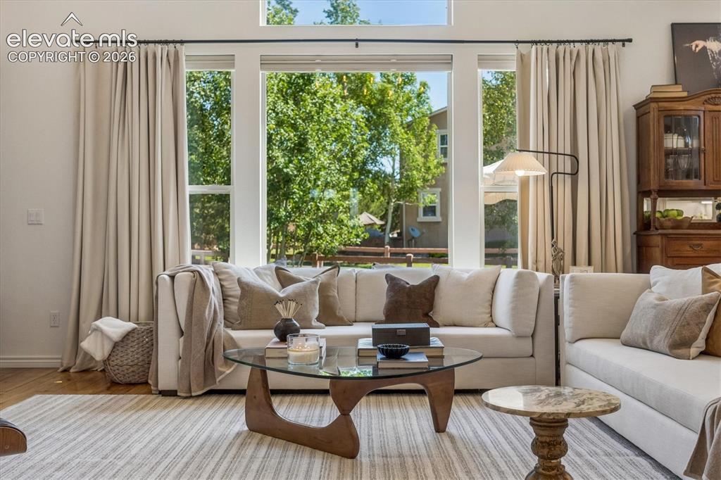 Image 8 of 50: Bright interior space featuring expansive windows