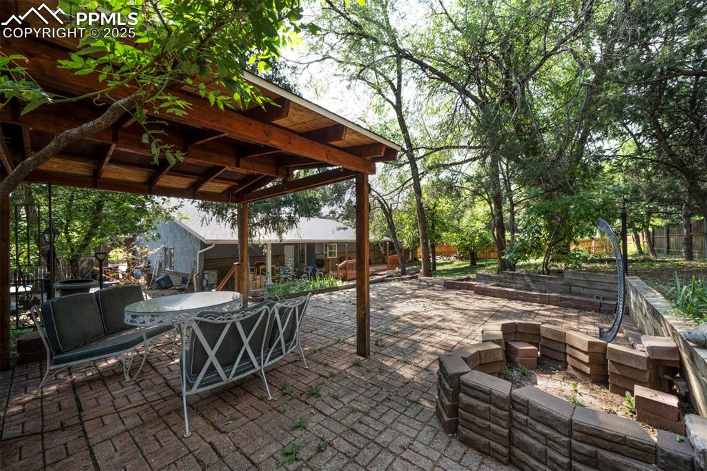 Image 38 of 44: View of patio / terrace with outdoor dining area