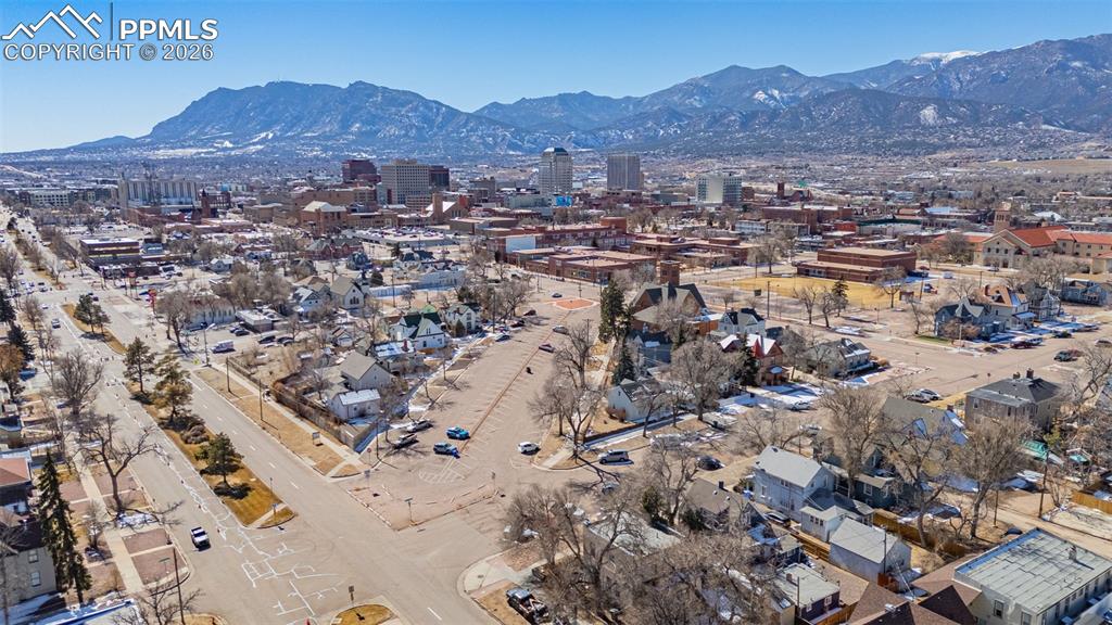 Image 30 of 33: Drone / aerial view with a mountain view and a city view