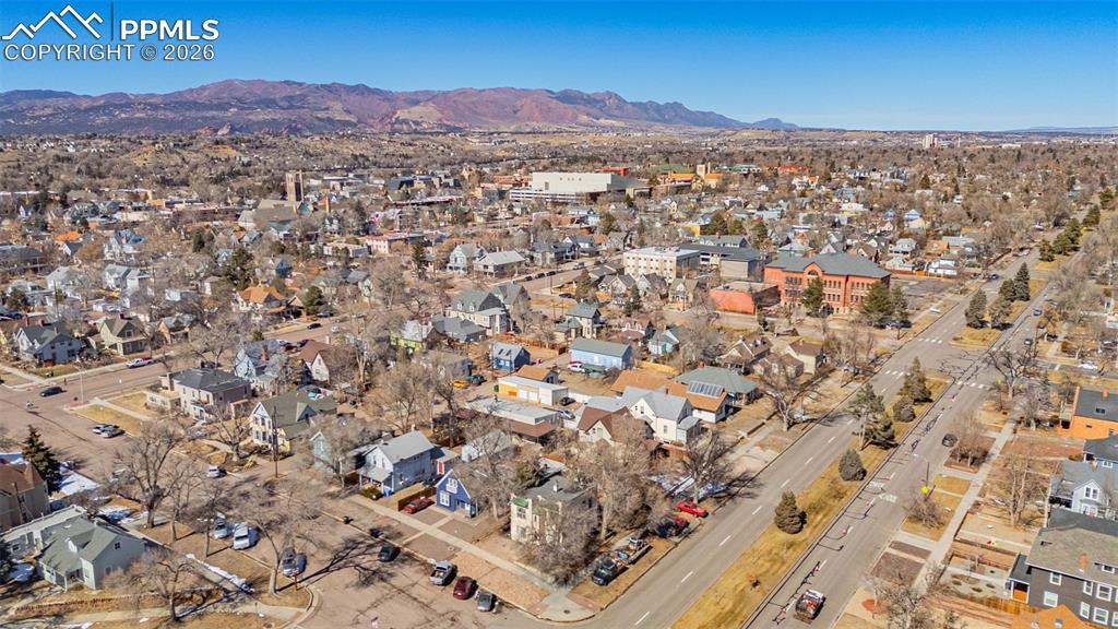 Image 32 of 33: Drone / aerial view featuring a residential view and a mountain view