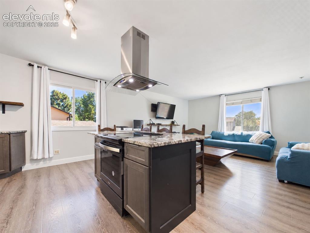 Image 12 of 50: Open-concept design creates an easy visual connection between the kitchen a