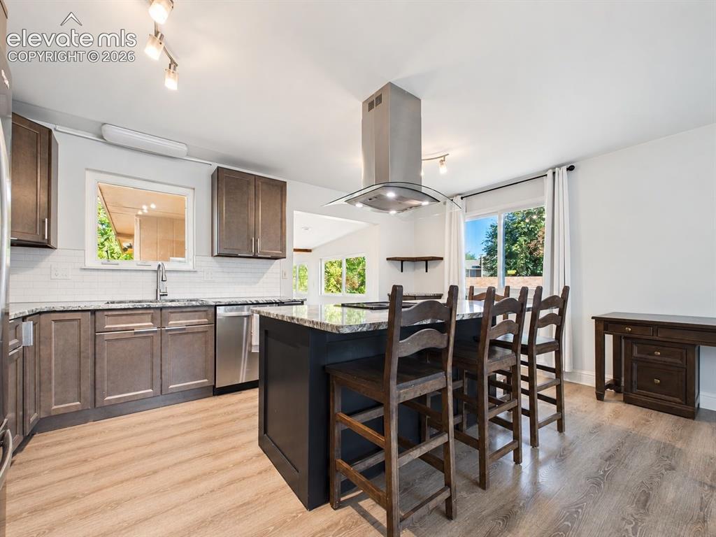 Image 13 of 50: Wide view captures the remodeled kitchen