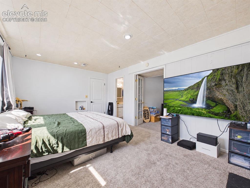 Image 31 of 50: Additional view of the spacious bedroom highlights generous floor space, re