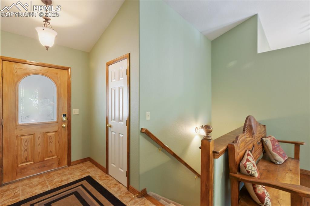 Image 10 of 43: Entryway with lofted ceiling