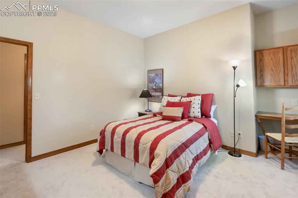 Image 34 of 43: Carpeted bedroom featuring baseboards