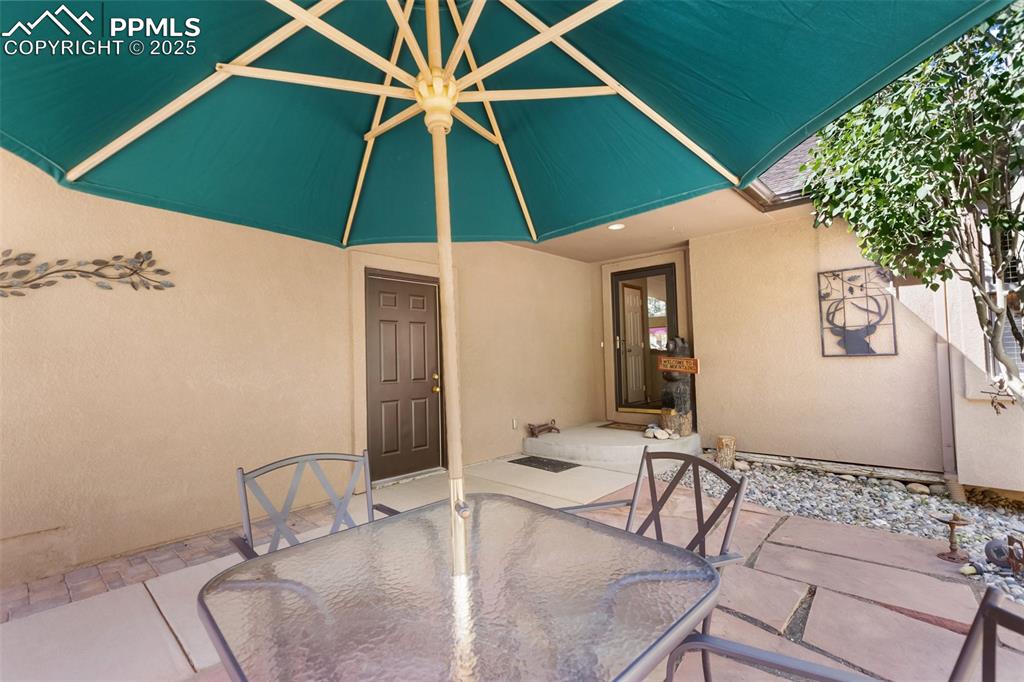 Image 8 of 43: View of patio featuring outdoor dining space