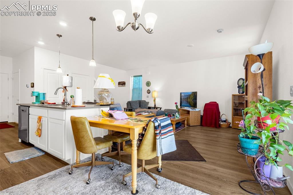 Image 6 of 27: Dining space featuring recessed lighting, dark wood-style floors, and an in
