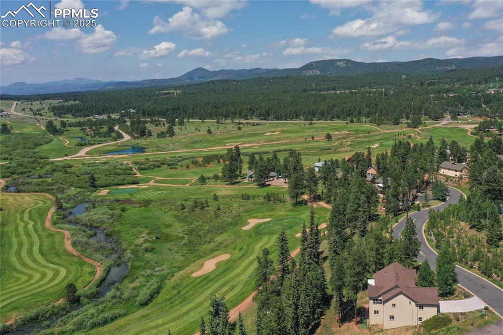 Image 46 of 47: Aerial view of a club and mountain view.
