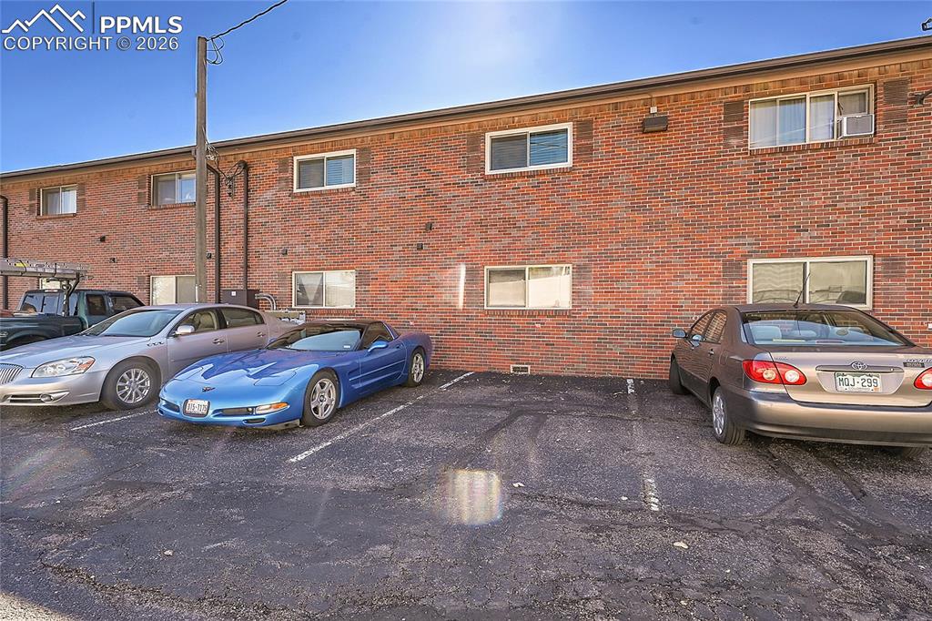 Image 27 of 42: Designated Parking Spot in Back of Building 
