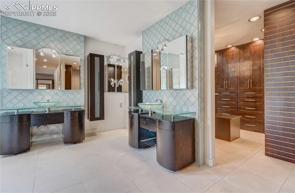 Image 18 of 50: Bathroom with decorative backsplash, light tile patterned flooring, and rec