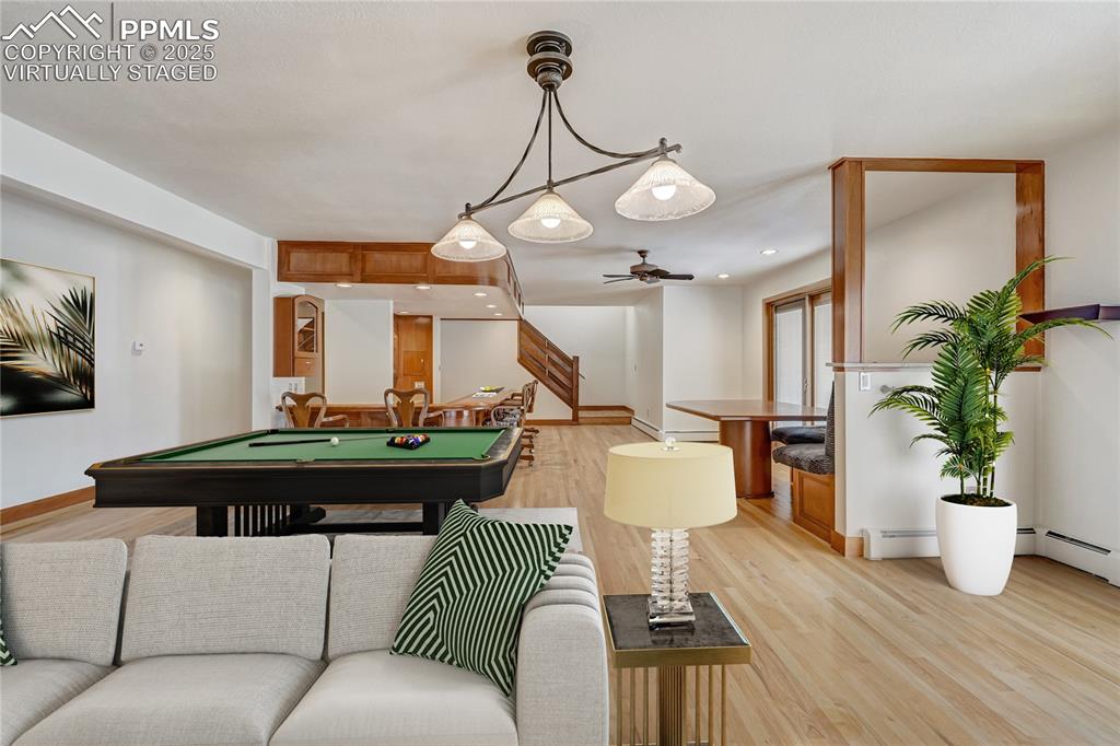 Image 25 of 50: Playroom featuring light wood-style floors, billiards table, recessed light